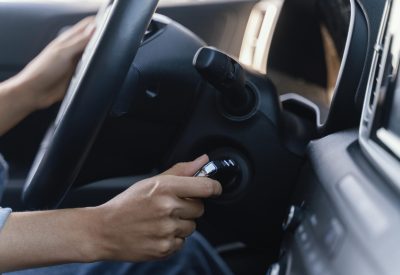 woman-starting-engine-her-car